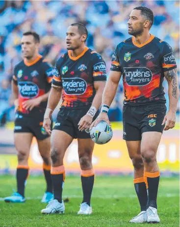  ??  ?? GET IT BACK: Benji Marshall (right) and his Tigers are looking to recapture their earlier form.