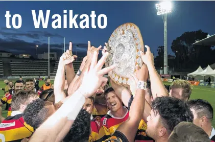  ?? PHOTO: GETTY IMAGES ?? Celebratio­n time . . . Jack Stratton of Waikato (centre) and his teammates lift the Ranfurly Shield after their win against Taranaki at Yarrow Stadium in New Plymouth yesterday.