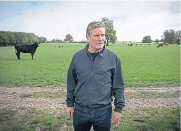  ??  ?? CONCERNS: Sir Keir Starmer at NFU president
Minette
Batters’ farm in
Wiltshire.