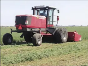  ?? PHOTO CHING LEE, CALIFORNIA FARM BUREAU FEDERATION ?? Yolo County farmer Jeff Merwin harvested his first cutting of alfalfa last week, which he said is about a month behind schedule.