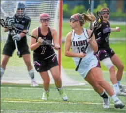  ?? PETE BANNAN — DIGITAL FIRST MEDIA ?? Radnor’s Julianne Puckette, here circling in front of Garnet Valley defenders Kamryn McNeal and Tish Minford and goalie Lauren Kinnee, was the county’s top goal scorer with 97.