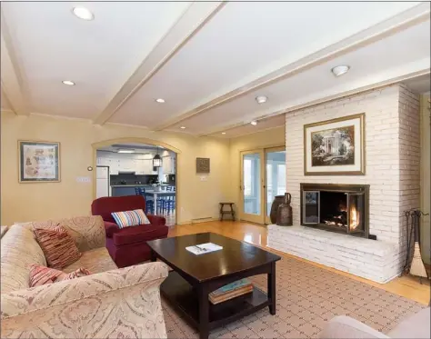  ?? Real Living Wareck D’Ostilio ?? The family room at 10 Stonewall Lane in Woodbridge is accented with a beamed ceiling and French doors to an enclosed porch.