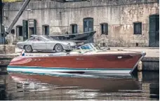  ??  ?? World’s fastest Riva Aquarama: Parked behind it is an example of 350GT, Lamborghin­i’s first production car and source of the V12 engines used to power the restored craft.