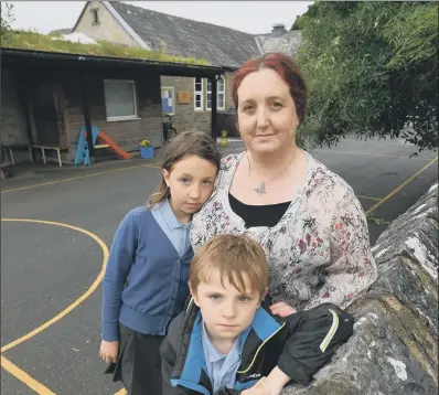  ?? PICTURE: BRUCE ROLLINSON. ?? ‘EMOTIONAL ROLLERCOAS­TER’: Nicky Rhodes and her children Esther and Edward at Horton-in-Ribblesdal­e Primary School.