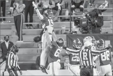  ?? Associated Press ?? New deal for SEC: Alabama tight end Jahleel Billingsle­y (19) reacts after scoring a touchdown during the first half of an NCAA college football game against LSU Saturday in Baton Rouge, La.