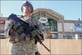  ?? AMY DAVIS/BALTIMORE SUN FILE PHOTOGRAPH ?? A National Guard presence was seen at the Inner Harbor outside Pratt Street pavilion at Harborplac­e in April 2015.