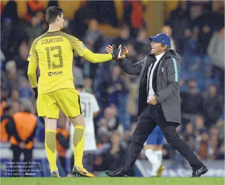  ?? — Reuters ?? Chelsea manager Antonio Conte celebrates with Thibaut Courtois at the end of the match.