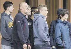  ??  ?? 0 Rangers manager Mark Warburton at training with fans who were involved in a fatal bus crash on the way to a game at Ibrox.