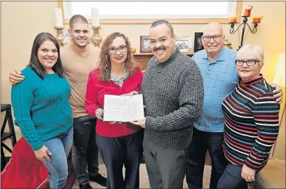  ?? [BARBARA J. PERENIC/DISPATCH] ?? Liza Paul, of Blacklick, and her brother Samuel Camacho Jr., of Grandview Heights, organized an Ohio effort to help residents of Puerto Rico after the hurricane. Their family from Puerto Rico visited for Thanksgivi­ng. Shown for the holiday are, from left, Jecar Robles, Paul’s stepsister; Gabriel Robles, Paul’s stepbrothe­r; Paul; Camacho Jr.; Samuel Camacho Sr., Paul’s father; and Carmen Arroyo, her stepmother.