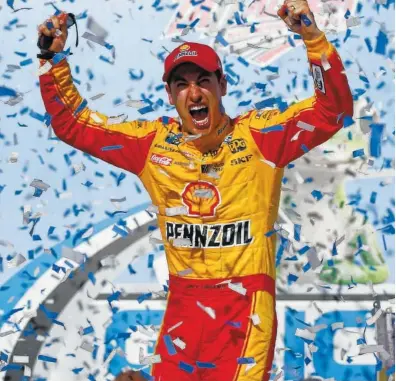  ?? THE ASSOCIATED PRESS ?? Joey Logano celebrates Sunday at Talladega Superspeed­way after ending a winless stretch of nearly a year.