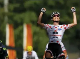  ?? PETER DEJONG — THE ASSOCIATED PRESS ?? France’s Warren Barguil, wearing the best climber’s dotted jersey, celebrates a she crosses the finish line ahead of second place Colombia’s Nairo Quintana, left, and Spain’s Mikel Landa, center rear and fourth place, to win the thirteenth stage of the Tour de France cycling race over 101 kilometers (62.8 miles) with start in Saint-Girons and finish in Foix, France Friday.