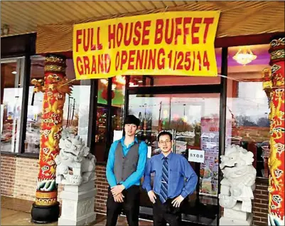  ?? GARY PULEO/FOR THE REPORTER ?? ANSON HUANG, left, and Tony Wang stand outside Full House Buffet in the Park Ridge Shopping Center.