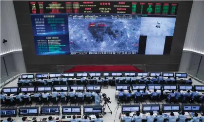  ?? Photograph: Xinhua/REX/Shuttersto­ck ?? The Beijing Aerospace Control Center (BACC) is abuzz on Tuesday, as China successful­ly lands the Chang’e-5 probe on the moon.