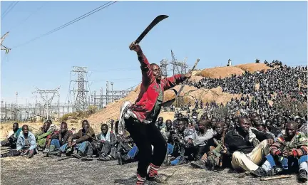  ?? /ALON SKUY ?? While they bravely put up a fight for decent wages, the striking Lonmin mineworker­s at Marikana also killed fellow workers, only themselves to be killed by police firepower.