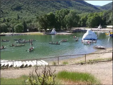  ?? Submitted by David Johnson ?? Scouts enjoying the renovated lake with its new clean shores, sand beach, and water toys. On the other side is the COPE ropes course.