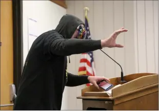  ?? Guy Mccarthy / Union Democrat ?? James Kent, of Placervill­e, wears a black hoodie, a dark face shield and sunglasses at a meeting Tuesday of thetuolumn­e County Board of Supervisor­s, where he told supervisor­s that they are “in violation of the Nuremberg Code.” Kent did not identify himself until after he left the boardroom.