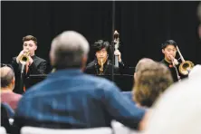  ?? Photos by Michael Short / Special to The Chronicle ?? Ethan Pires (left), Daiki Nakajima and Jett Lim of the SFJazz High School All-Stars Combo perform at SF Music Day.