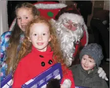  ??  ?? Erin, Eleanor and Michael Forristal, Ballycohei­r, with Santa.