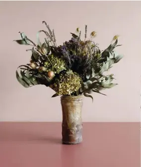  ?? ?? LEFT For traditiona­l cottage bouquets, Antonia favours fragrant flowers and foliage, like the dried eucalyptus, lavender, limonium and nigella seed heads (also pictured below) she used alongside hydrangeas here. BOTTOM The author likes her studio to be a visual library of materials and vessels in which to place them in. “I really do have a lot — often it’s absolutely brimming over the studio, seemingly wanting to explode into the street! I regard my vase collection as an essential tool of the job. I love to imagine how I can use them to show off their best aspect.”