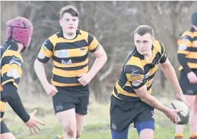  ??  ?? Offloading EK’s Ethan Aitken eyes a pass against Cambuslang