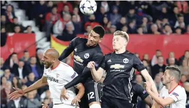  ?? REUTERS ?? STRONG PERFORMANC­E: Manchester United’s Chris Smalling and Scott McTominay both impressed in their midweek clash against Sevilla.