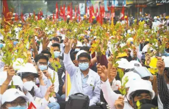  ?? Associated Press ?? Students from the University of Medicine in Mandalay protest the military leaders who seized power in Myanmar. Many workers have joined a civil disobedien­ce campaign against the junta.