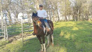  ??  ?? Physical therapist Edwin Santos riding his horse Bandit.