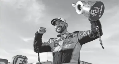  ?? JERRY FOSS/AP ?? J.R. Todd celebrates after getting his fifth win of the year in his DHL Toyota Camry and in doing so taking over the category points lead on Sunday at the NHRA Toyota Nationals at The Strip at Las Vegas Motor Speedway.