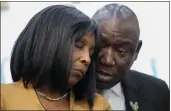  ?? GERALD HERBERT — THE ASSOCIATED PRESS ?? Civil rights Attorney Ben Crump speaks to RowVaughn Wells, mother of Tyre Nichols, at a news conference in Memphis, Tenn., on Friday. Nichols died after being beaten by Memphis police officers,