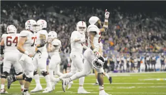  ?? Tim Warner / Getty Images ?? Stanford running back Bryce Love (right) has one season of college eligibilit­y remaining, but he could bolt for the NFL instead after surpassing 2,000 yards rushing this season.