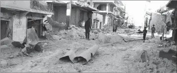  ??  ?? Un quartier rebelle, peu après un bombardeme­nt aérien