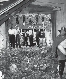  ?? (File Photo/AP) ?? Debris is strewn from a bomb that exploded Sept. 15, 1963, near a basement room of the 16th Street Baptist Church in Birmingham, killing four Black girls.