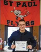  ?? CARY ASHBY / THE NORWALK REFLECTOR ?? St. Paul High School senior Nicholas Roth shows off his award for being the “outstandin­g witness” during the regional mock trial competitio­n.