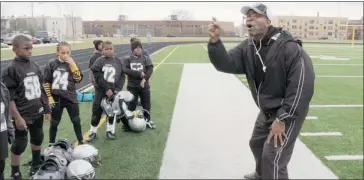  ?? Head Games ?? A coach gives a pep talk to some young football players in a scene from Steve James’ Head Games.