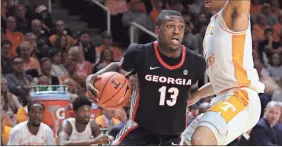  ?? Shawn Millsaps) ?? Georgia forward E’Torrion Wilridge (13) drives the ball against Tennessee forward Grant Williams (2) in the first half of an NCAA college basketball game Saturday, Jan. 5, 2019, in Knoxville, Tenn. (AP Photo/