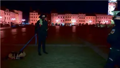  ??  ?? ABOVE:
Czech police have words with the ‘artistic practical joker’ who broke the curfew to walk his stuffed toy dog.