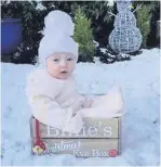  ??  ?? • Billie’s first snow day at 6 months