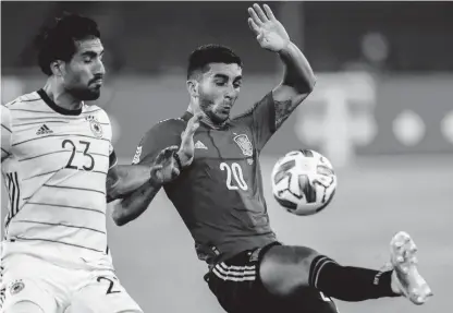  ?? AP ?? Germany’s Emre Can (left) duels for the ball with Spain’s Ferran Torres during the UEFA Nations League match at the Mercedes-Benz Arena stadium in Stuttgart, Germany yesterday