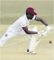  ?? (Photos: AFP) ?? West Indies batsman Nkrumah Bonner plays a shot during the fifth day of the first Test match against Bangladesh at Zahur Ahmed Chowdhury Stadium in Chittagong on Sunday.