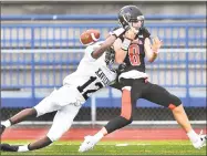  ?? Catherine Avalone / Hearst Connecticu­t Media ?? Xavier’s Osiah Wiggins, left, breaks up a pass intended for Shelton’s David Yakowicz on Thursday in West Haven.