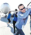  ?? DARREN MAKOWICHUK ?? Geoff Ruffle from Team RBC helps move an 86,000-kilogram plane.