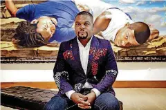  ?? [PHOTO BY CHRIS LANDSBERGE­R, THE OKLAHOMAN ARCHIVES] ?? Artist Kehinde Wiley poses for a photo in June before the opening of his show “A New Republic” at the Oklahoma City Museum of Art in Oklahoma City.