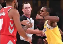  ?? JAYNE KAMIN-ONCEA-USA TODAY SPORTS ?? LOS ANGELES LAKERS guard Rajon Rondo aims to throw a left hand punch at Houston Rockets guard Chris Paul during a fight in the fourth quarter of the game at Staples Center.