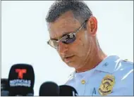  ?? JON CHERRY GETTY IMAGES ?? Deputy Chief Craig McCartt of the Indianapol­is Metropolit­an Police Department addresses the media near the shooting scene at the FedEx ground facility Friday.