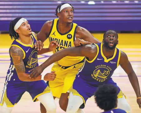  ?? Scott Strazzante / The Chronicle ?? Draymond Green ( right) and Damion Lee box out Myles Turner during the second quarter of Tuesday’s loss.