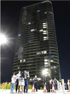  ??  ?? File photo shows residents returning back to their apartments following an inspection of Opal Tower by engineers and firefighte­rs in Sydney. — AFP photo