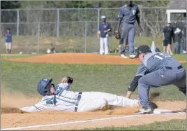  ?? PHOTO BY ROB WORMAN ?? La Plata’s Peytyn Gray slides through the tag of Patuxent’s Reese Crounse with a stolen base in the fourth inning of the teams’ Class 2A South Region Section I final at La Plata on Tuesday afternoon. La Plata defeated Patuxent 5-4.