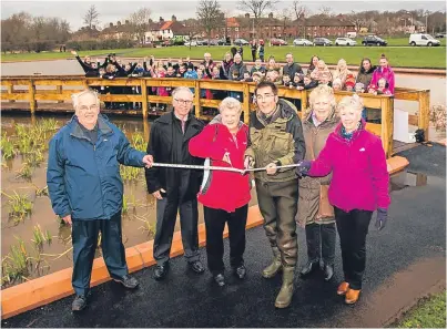  ?? Picture: Steve MacDougall. ?? Front, from left: organiser Martin Rogers, Councillor Mike Shirkie, Lynn Hoey, Nick Benge, Dorothy Wright and Marilyn King, from the community council, cutting the ribbon.