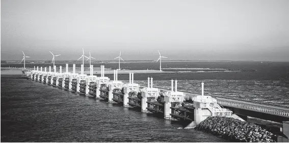  ?? Robas / Getty Images ?? The Ike Dike proposal is based on a similar concept to Holland’s Oostersche­ldekering storm surge barrier, which is nearly 5 miles long.