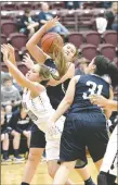  ?? Bud Sullins/Special to Siloam Sunday ?? Siloam Springs sophomore Chloe Price fights her way through a pair of Greenwood defenders Friday at Panther Activity Center. Greenwood defeated the Lady Panthers 45-40.